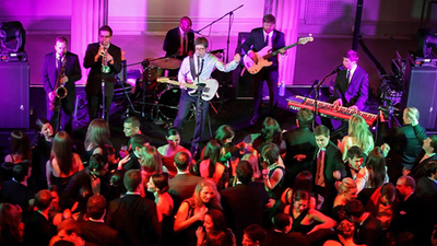 Revue band performing for live guests at a private event